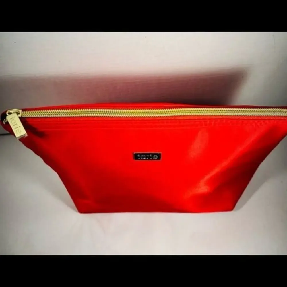 Tarte red cosmetic bag/ clutch, nice size with beautiful purple satin interior